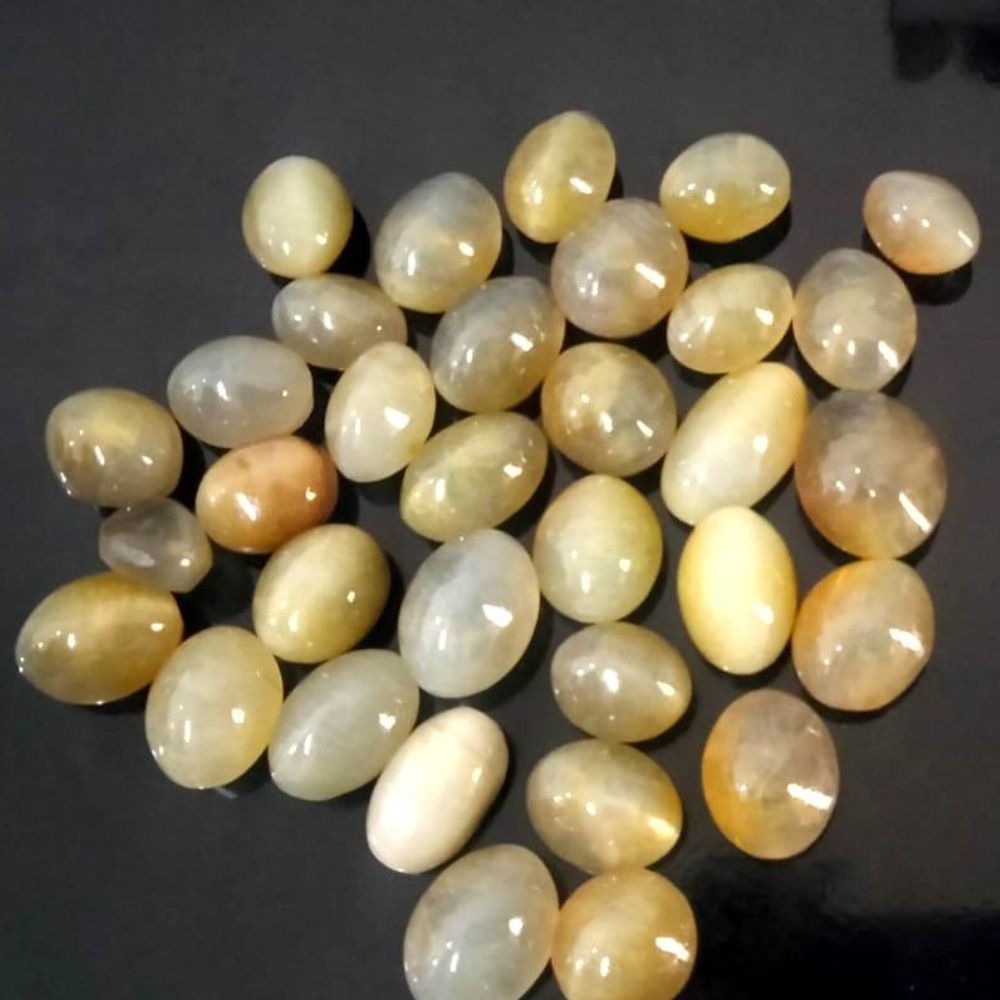 Natural Ceylon Touch Yellow Cats Eye Cabochon Oval Shape Fine Quality Loose Gemstone at Wholesale Rates (Rs 60/Carat)